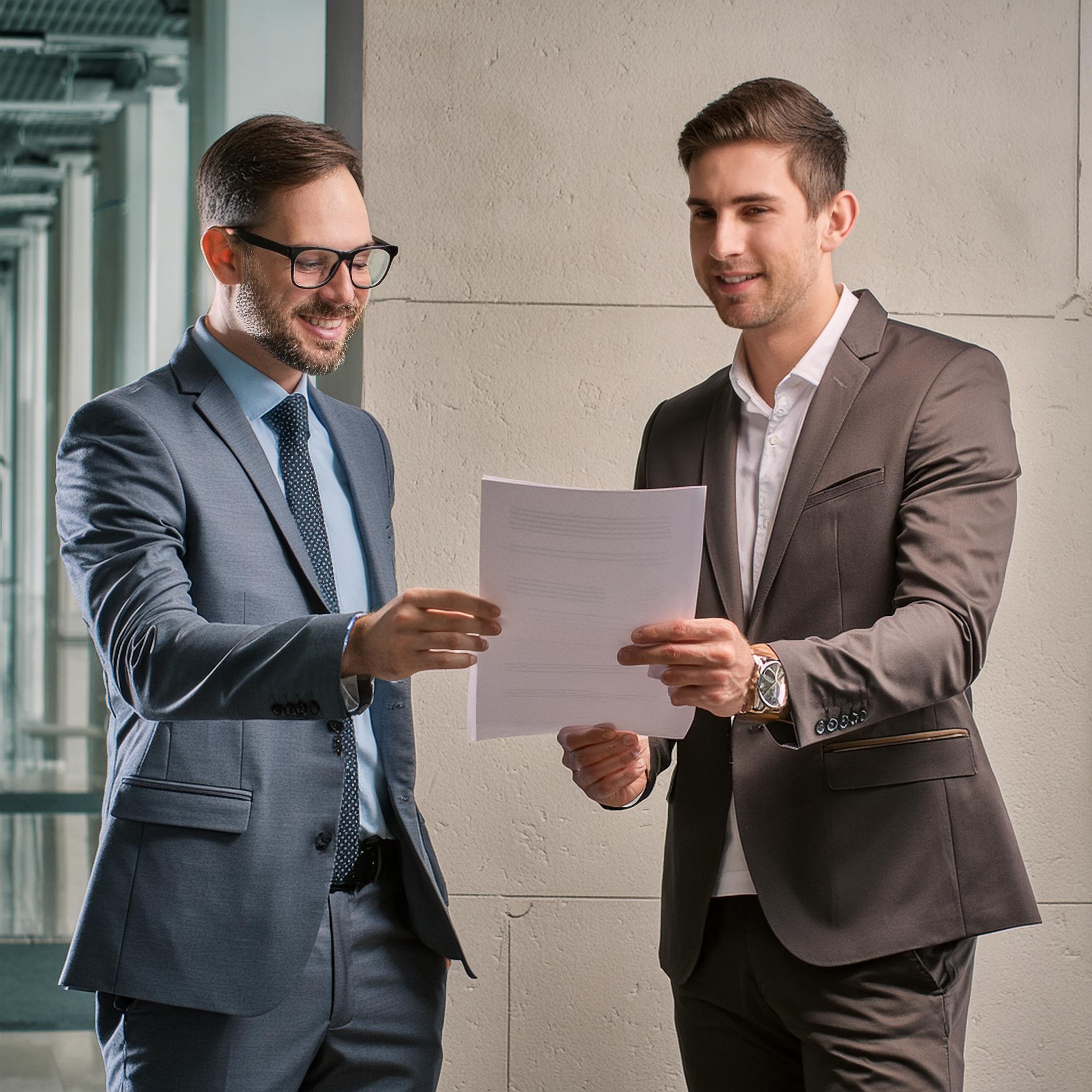 firefly-business-man-want-holding-up-a-document-and-showing-the-other-customer-the-great-features-67 Understanding the Buyer's Journey in Marketing - BEAM Automation