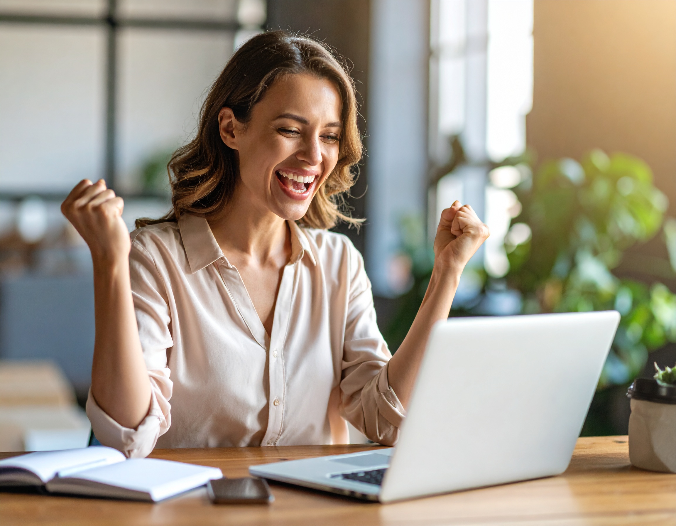 firefly_happy-woman-using-laptop-and-happy-she-received-a-good-email-message-378489 5 Free Ways to Double Customer Engagement Using Your CRM | BEAM Automation