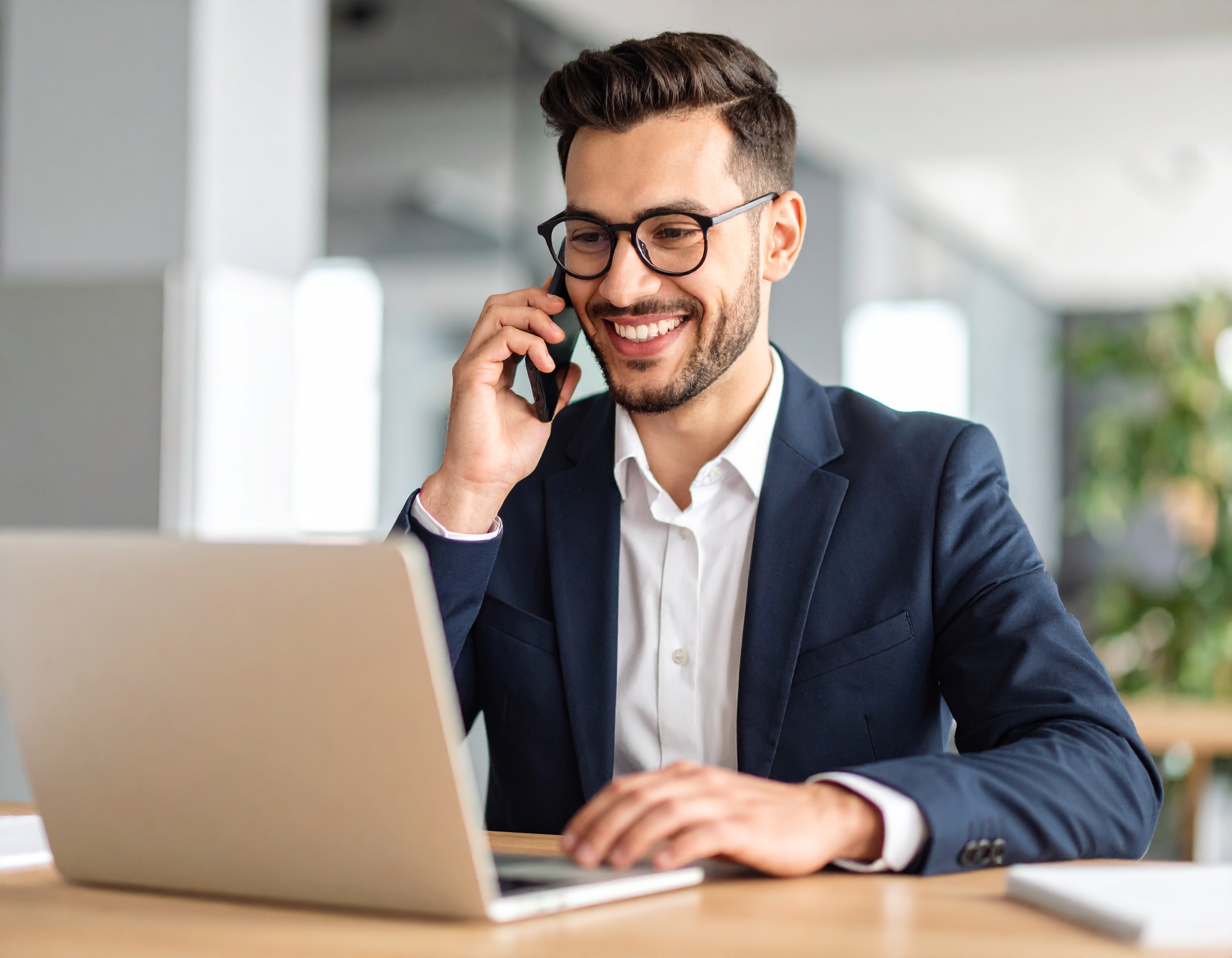 firefly_show-business-person-on-phone-at-best-with-computer-and-is-having-a-happy-conversatio-292374 3 CRM Hacks to Increase Sales Without New Leads | Beam Automation